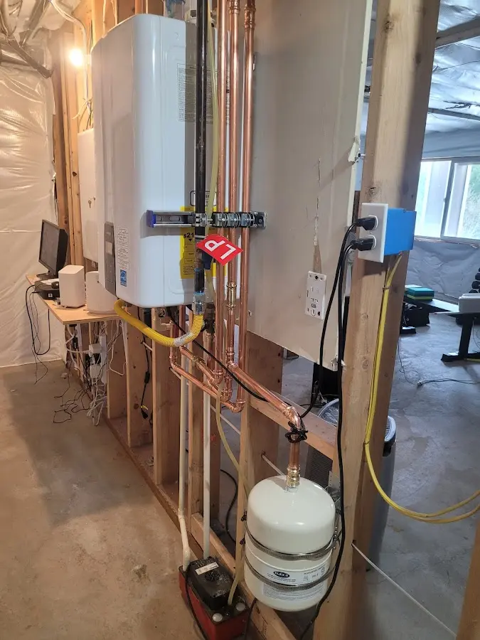 Licensed plumber repairing a kitchen sink in Wellston
